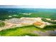 An aerial view that captures the scope of a new home community under development surrounded by mature trees and ponds at 281 Blue Haw Dr, Moncks Corner, SC 29461