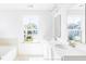 Elegant bathroom with double sinks and a bathtub at 281 Blue Haw Dr, Moncks Corner, SC 29461