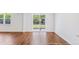 View of dining area with hardwood floors and sliding glass doors to patio at 281 Blue Haw Dr, Moncks Corner, SC 29461