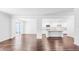 Open concept living room with hardwood floors and kitchen view at 281 Blue Haw Dr, Moncks Corner, SC 29461