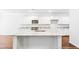 Modern kitchen featuring white cabinets, granite countertops, and hardwood floors at 281 Blue Haw Dr, Moncks Corner, SC 29461