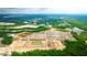 New construction community showing homes near green spaces, ponds and construction zones surrounded by roadways and commercial development at 281 Blue Haw Dr, Moncks Corner, SC 29461