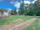 Single-wide manufactured home with a covered porch and large yard at 113 Ripple Ave, Moncks Corner, SC 29461