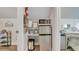 Small kitchenette with microwave, mini-fridge, and essential supplies at 705 S Magnolia St, Summerville, SC 29483