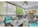 Spacious screened porch with grill and seating area at 705 S Magnolia St, Summerville, SC 29483