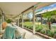 Front porch with wicker furniture and view of backyard at 705 S Magnolia St, Summerville, SC 29483