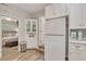 White kitchen with corner cabinet and view into bedroom at 705 S Magnolia St, Summerville, SC 29483