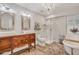 Elegant bathroom with double vanity, shower, and clawfoot tub at 705 S Magnolia St, Summerville, SC 29483