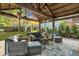 Cozy pergola with seating area and string lights at 705 S Magnolia St, Summerville, SC 29483