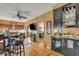 Home bar with mini-fridge and shelving for glassware at 705 S Magnolia St, Summerville, SC 29483