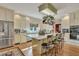 Open concept kitchen with island seating and stainless steel appliances at 705 S Magnolia St, Summerville, SC 29483