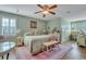 Comfortable main bedroom with sitting area and en-suite bathroom at 705 S Magnolia St, Summerville, SC 29483