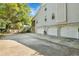 Three-car garage with ample parking space and side yard access at 705 S Magnolia St, Summerville, SC 29483