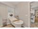 Spa-like bathroom with clawfoot tub and shiplap wall at 705 S Magnolia St, Summerville, SC 29483