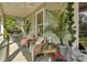 Charming front porch with wicker furniture, creating a relaxing outdoor space at 705 S Magnolia St, Summerville, SC 29483