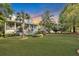 Two-story home with metal roof, porch, and landscaped yard at 705 S Magnolia St, Summerville, SC 29483