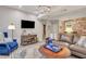 Comfortable living room with leather sofas, area rug, and accent chairs at 705 S Magnolia St, Summerville, SC 29483
