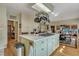 Spacious kitchen featuring a large island, ample cabinetry, and stainless steel appliances at 705 S Magnolia St, Summerville, SC 29483