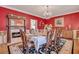 Formal dining room with a large table, chandelier, and antique fireplace at 705 S Magnolia St, Summerville, SC 29483