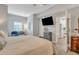 King size bed, TV, and view into small kitchenette at 705 S Magnolia St, Summerville, SC 29483