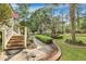 Attractive home exterior with well-manicured lawn, brick walkway, and lush landscaping at 705 S Magnolia St, Summerville, SC 29483