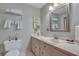Clean bathroom with single vanity and decorative mirror at 705 S Magnolia St, Summerville, SC 29483