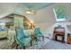 Large bedroom with a king-size bed and a rustic wood wall at 705 S Magnolia St, Summerville, SC 29483