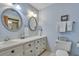 Well-appointed bathroom with double vanity and hexagon tile floor at 705 S Magnolia St, Summerville, SC 29483
