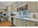 Bright kitchen with white cabinets, double sink, and marble countertops at 705 S Magnolia St, Summerville, SC 29483