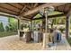 Covered outdoor kitchen and patio area, complete with fireplace and seating at 705 S Magnolia St, Summerville, SC 29483