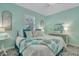 Bedroom with a queen-size bed and teal accents at 705 S Magnolia St, Summerville, SC 29483