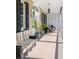 Relaxing porch with striped couch and wicker chairs, offering outdoor seating at 40 Laurens St, Charleston, SC 29401