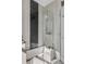 Bathroom featuring a glass-enclosed bathtub and marble tile at 40 Laurens St, Charleston, SC 29401
