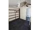 Empty bedroom with dark carpet, built-in shelves, and ceiling fan at 1449 Swamp Angel Ct, Charleston, SC 29412