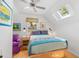 Bright bedroom with a comfy bed and wood floors at 218 E Huron Ave, Folly Beach, SC 29439