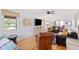 Open living space with leather sofas and hardwood floors at 218 E Huron Ave, Folly Beach, SC 29439