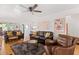 Spacious living room with leather furniture and hardwood floors at 218 E Huron Ave, Folly Beach, SC 29439
