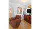 Cozy sitting area with an armchair and wood floors at 218 E Huron Ave, Folly Beach, SC 29439
