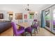 Dining room features a wooden table and purple chairs at 218 E Huron Ave, Folly Beach, SC 29439