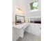 Bathroom with skylight, white vanity, and tiled floor at 218 E Huron Ave, Folly Beach, SC 29439