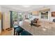 Modern kitchen with island, stainless steel appliances, and granite countertops at 218 E Huron Ave, Folly Beach, SC 29439