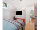Main bedroom with a TV and access to a second bedroom at 218 E Huron Ave, Folly Beach, SC 29439
