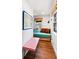 Small bedroom with a twin bed and built in shelving at 218 E Huron Ave, Folly Beach, SC 29439