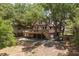 Two-story home with large deck and lush landscaping at 218 E Huron Ave, Folly Beach, SC 29439