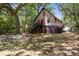 Quaint cottage with whimsical exterior paint and a charming front porch at 218 E Huron Ave, Folly Beach, SC 29439
