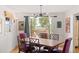 Bright dining room with wooden table, purple chairs, and stunning water views at 218 E Huron Ave, Folly Beach, SC 29439