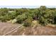Aerial view of waterfront home with private dock and lush vegetation at 218 E Huron Ave, Folly Beach, SC 29439