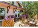 Relaxing deck with wooden furniture and waterfront views at 218 E Huron Ave, Folly Beach, SC 29439