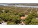 Aerial view of property showing home, landscaping, and marsh access at 218 E Huron Ave, Folly Beach, SC 29439