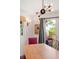 Dining room with wooden table, access to deck, and water views at 218 E Huron Ave, Folly Beach, SC 29439